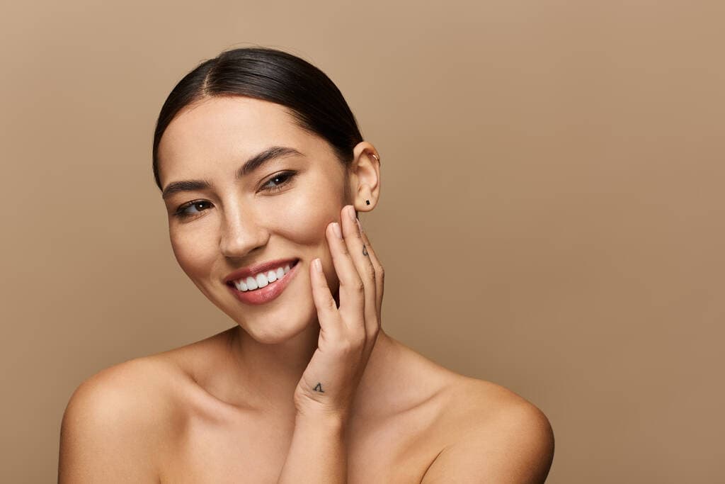 Woman with radiant, glowing skin after an aesthetic treatment at Sultan Beauty, Cardiff
